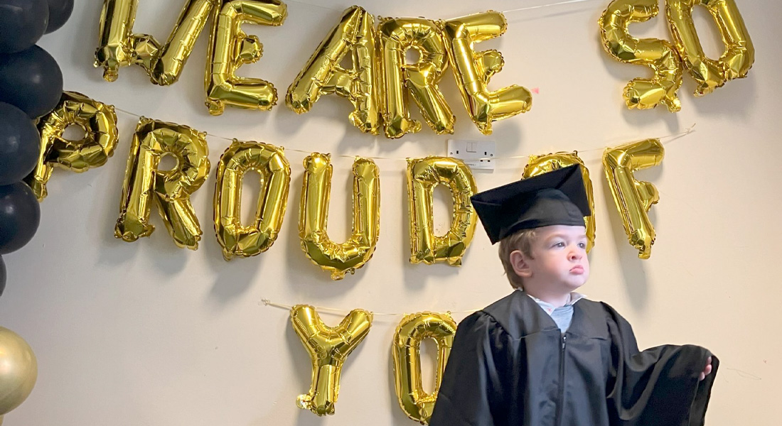 child at peter pan graduation ceremony